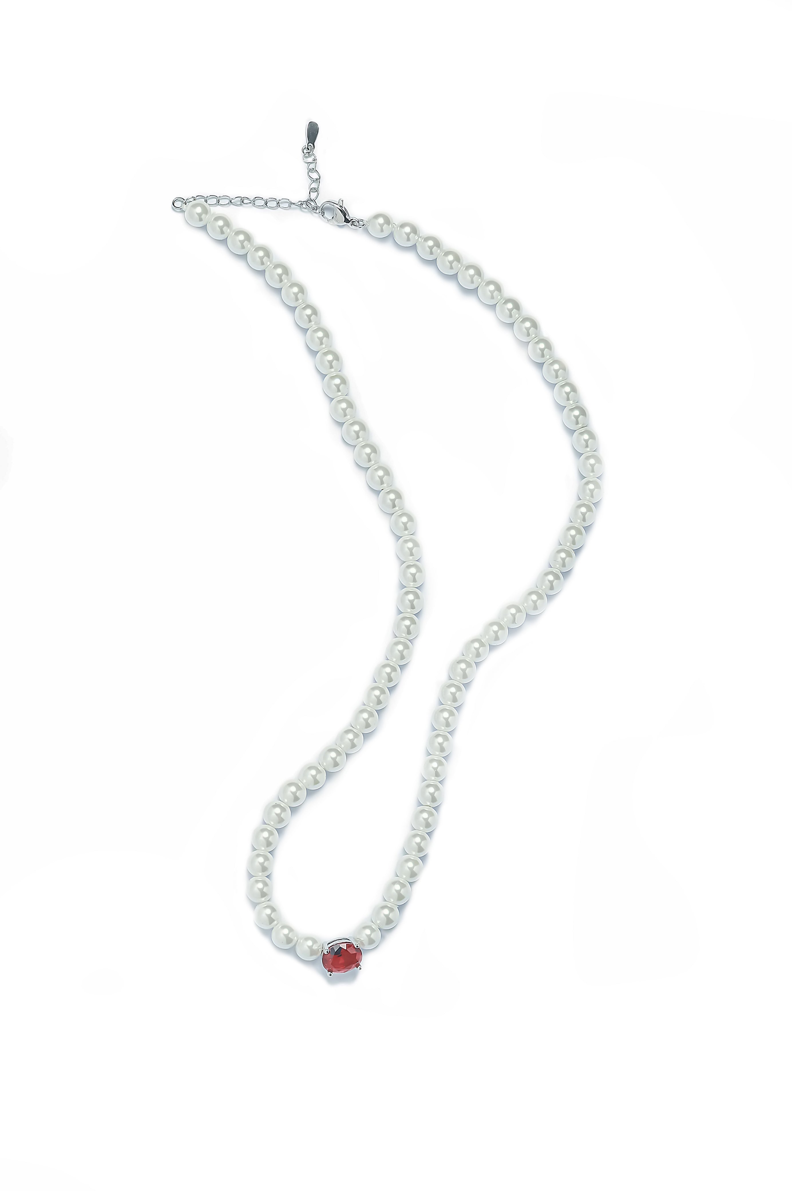Aiko Tanaka Aka no Kyokai pearl necklace, a strand of small white pearls with a single red stone at the center, on white
