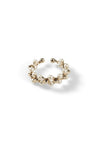 Aiko Tanaka Enrei ring seen from above, a gold open band of pearls and small gold flowers, on a white background