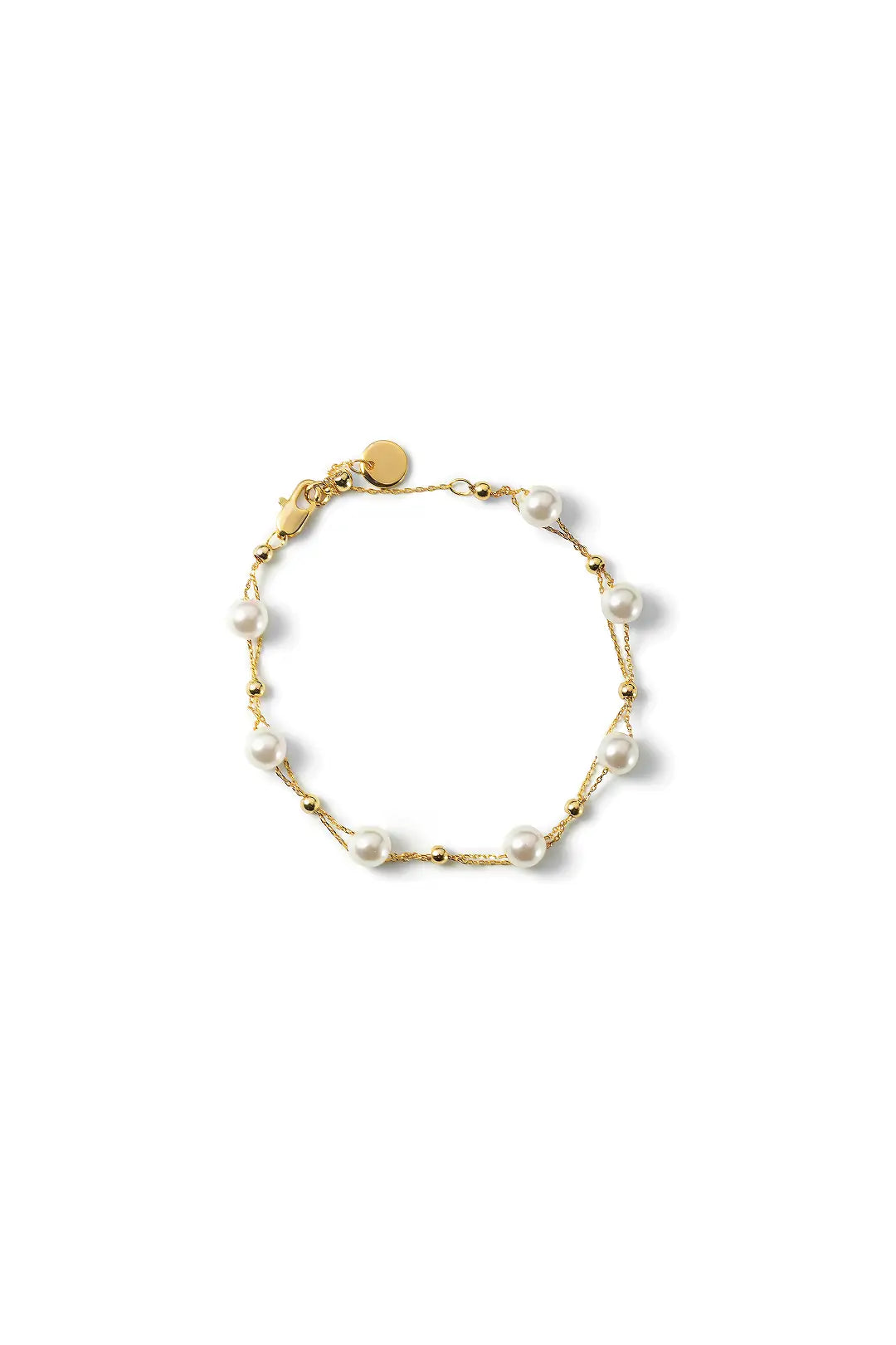 Aiko Tanaka Tsuzuri bracelet, a fine gold chain with small spaced pearls and a round charm, on a white background
