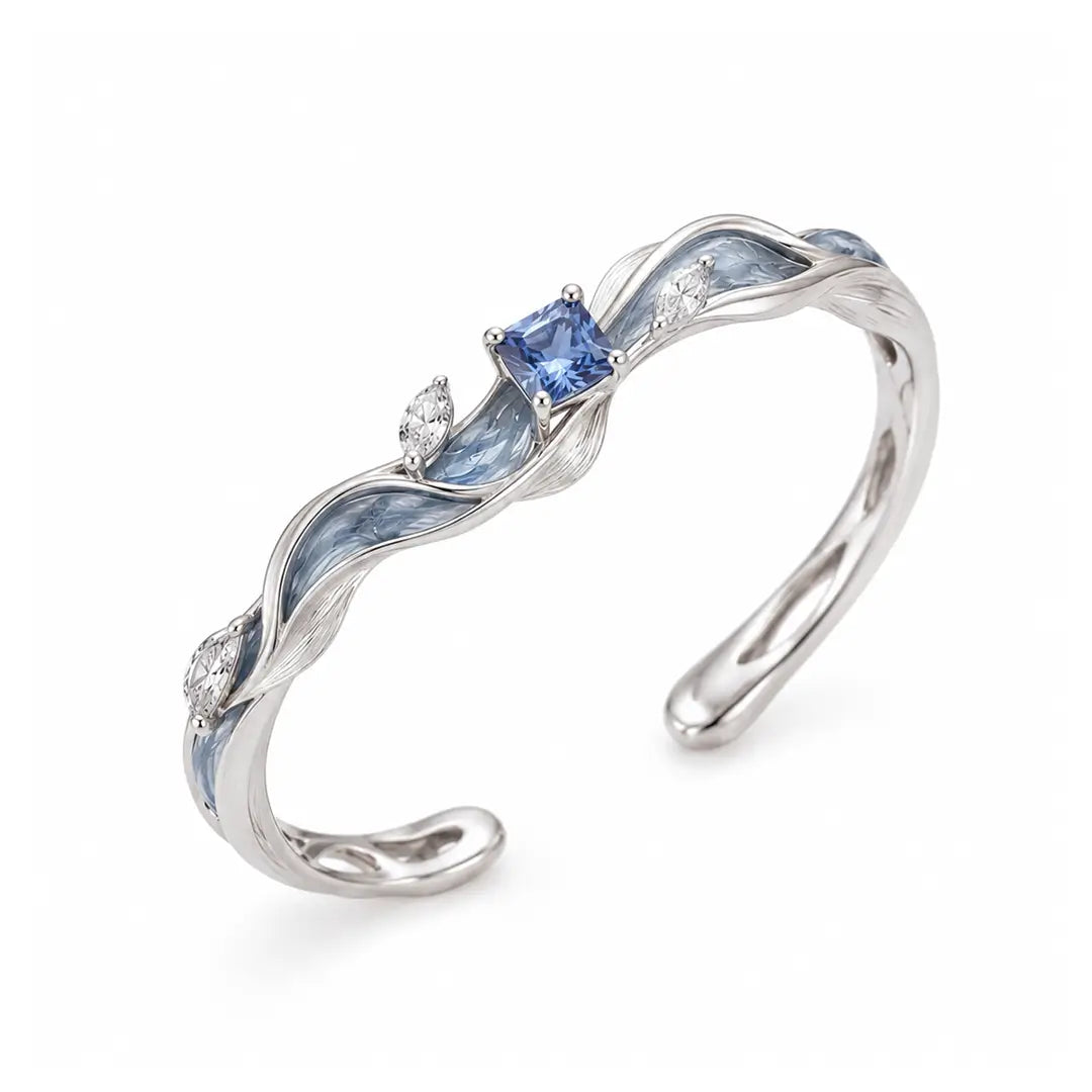 Aiko Tanaka High Jewelry No. 021 ring, an open silver band wrapped in blue enamel with a blue stone, white background