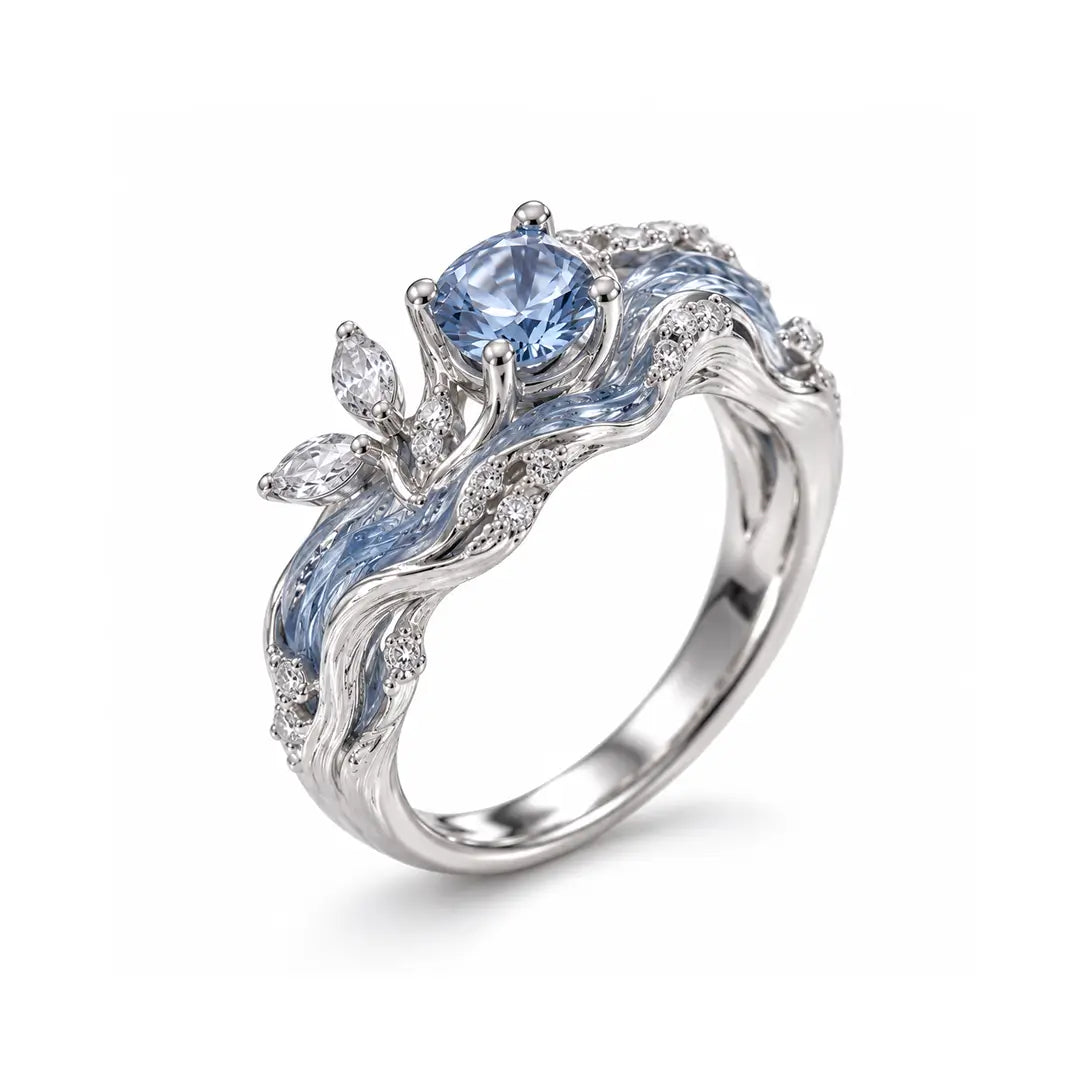 Aiko Tanaka High Jewelry No. 024 ring, a silver band of blue enamel waves and leaves around a blue stone, white background
