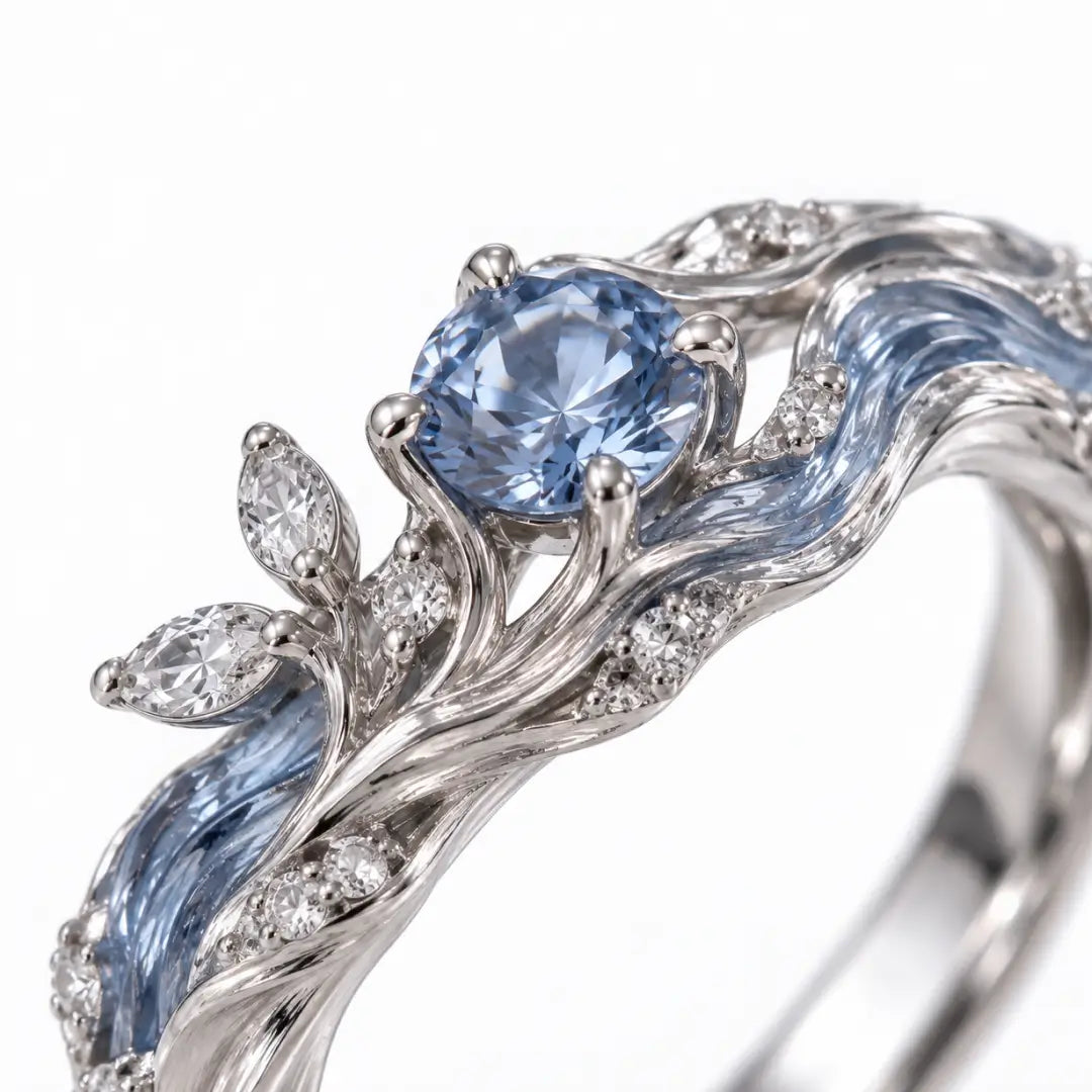 Aiko Tanaka High Jewelry No. 024 ring close-up, a round blue stone set among blue enamel waves and crystal leaves