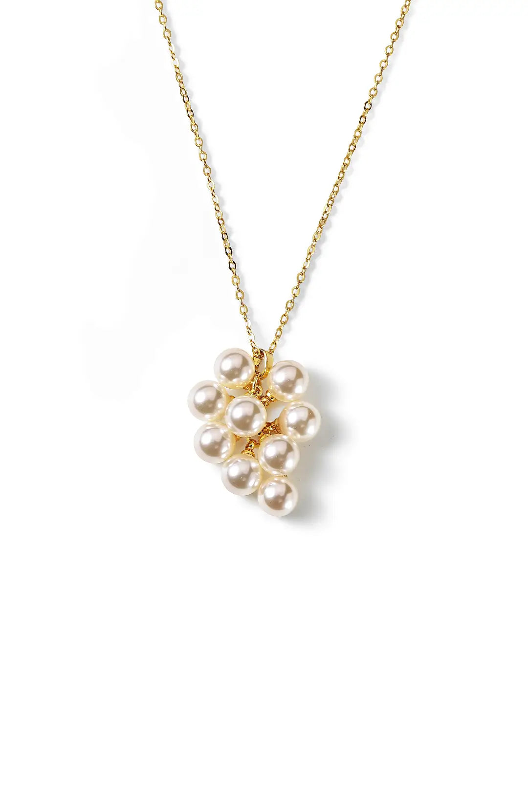 Aiko Tanaka Yorika necklace, a gold chain with a cluster of small white pearls as a pendant, on a white background
