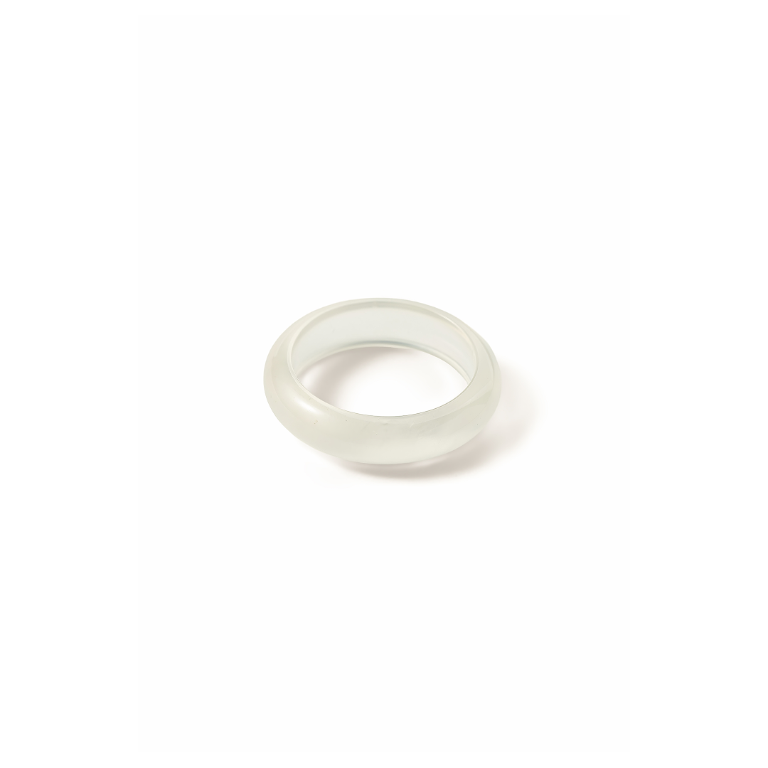 Aiko Tanaka ring component, a plain polished white jade band shown on its own on a white background