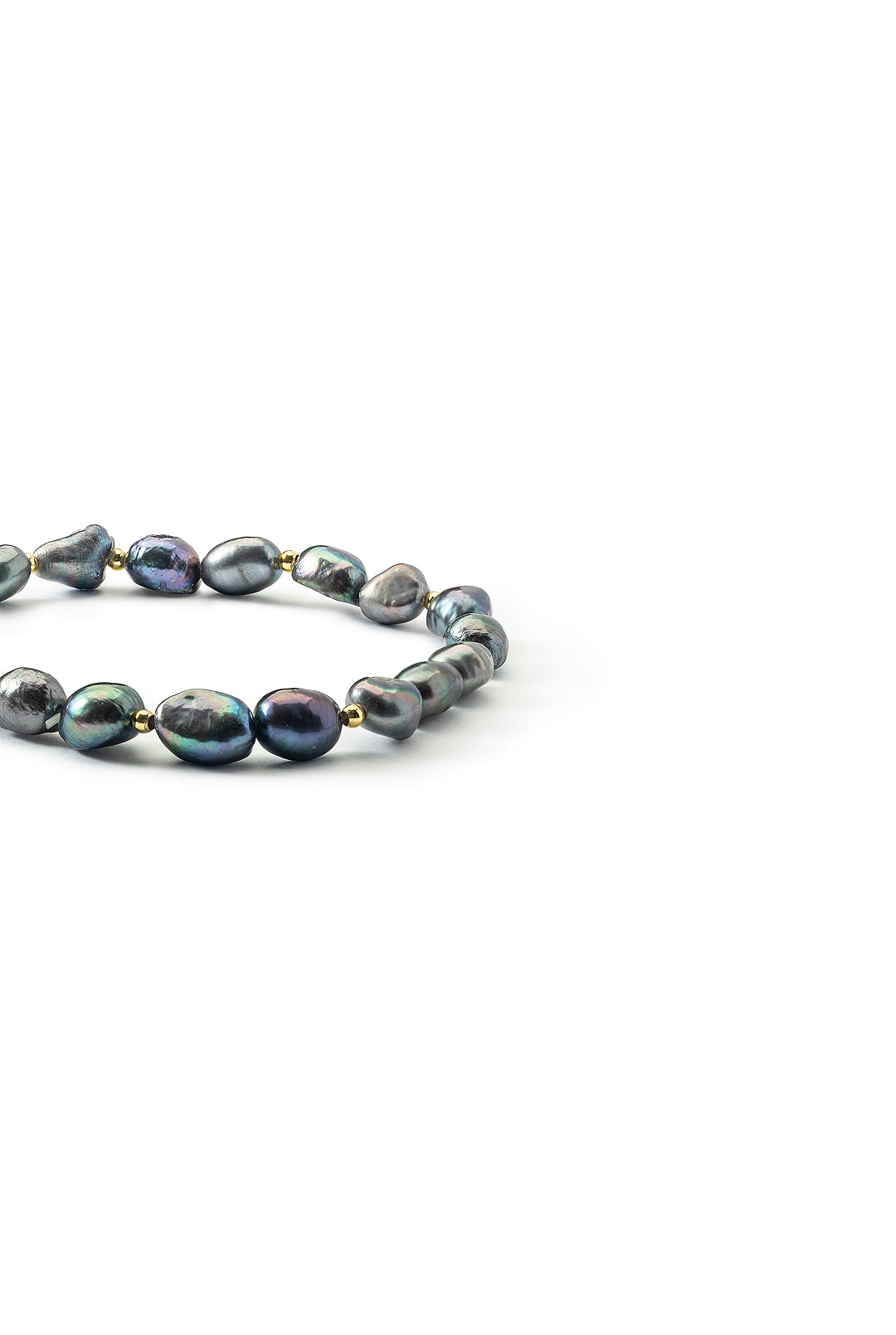 Side view of the Aiko Tanaka Yoru no Shizuku black pearl bracelet showing its peacock-toned baroque pearls, on white