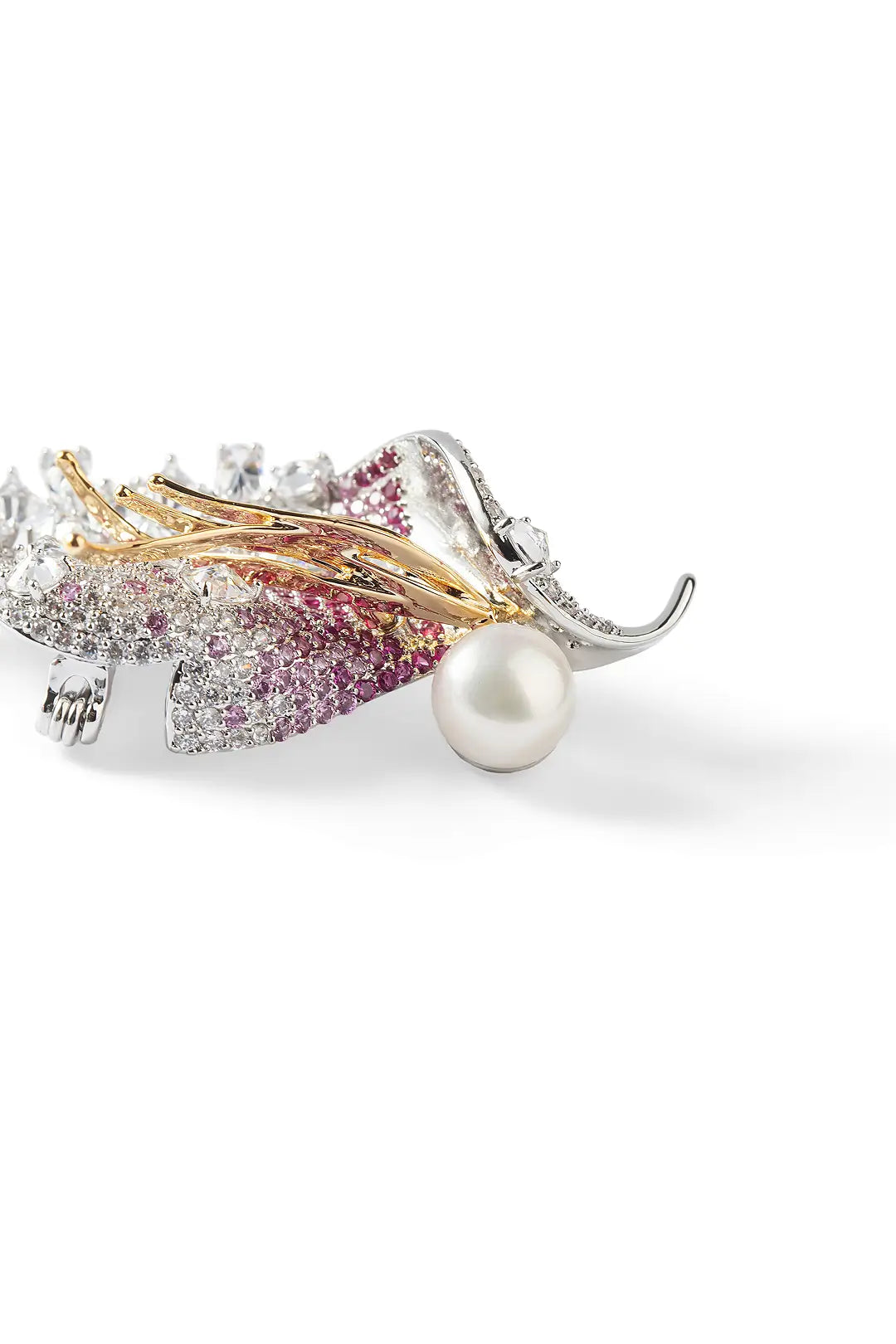 Aiko Tanaka Akatsubasa brooch close-up, pink and orange crystal feathers with a white pearl, on a white background