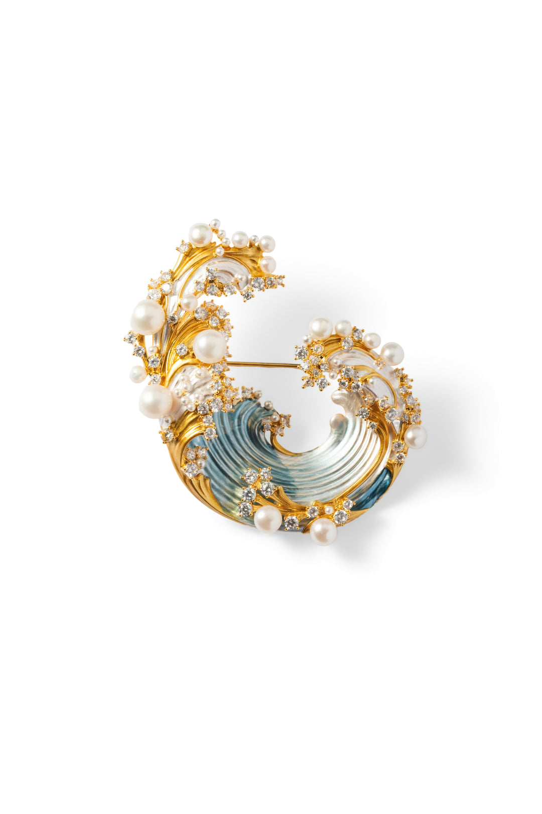 Aiko Tanaka Shiosai no Wa brooch, a gold wave curl with blue enamel and clusters of white pearls, on white