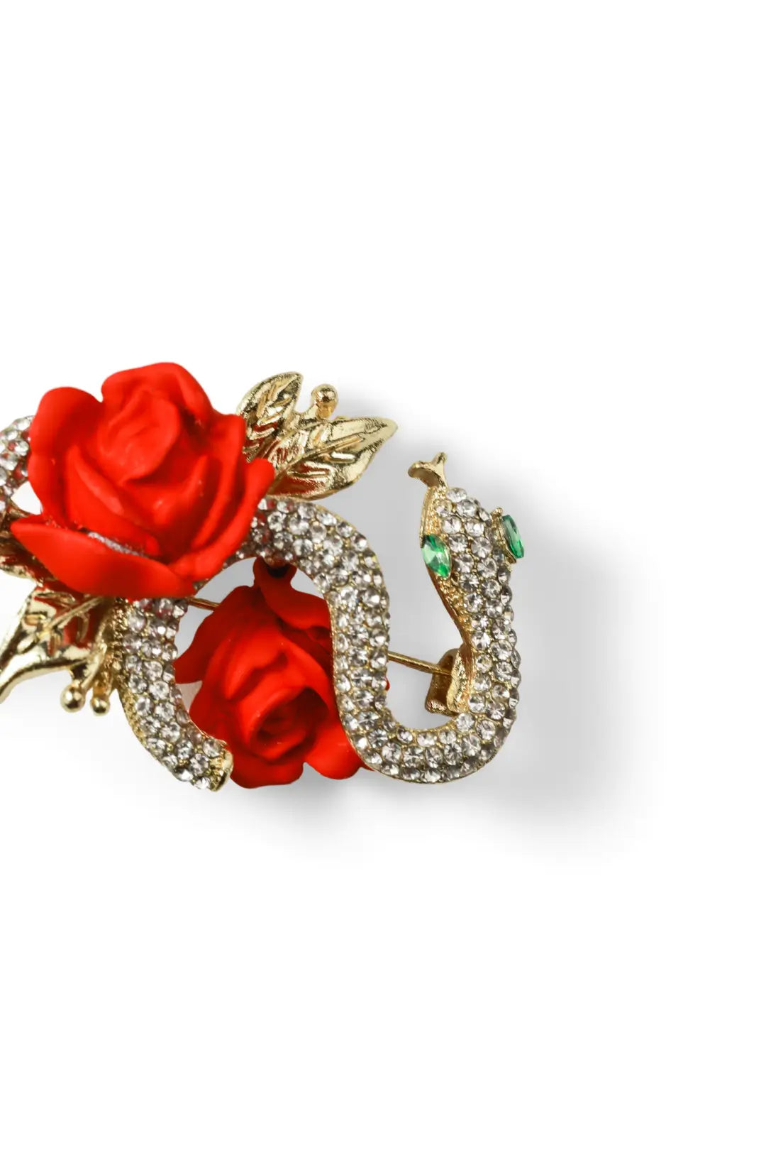 Aiko Tanaka Hebi no Chigiri brooch, a gold crystal snake coiled around red carved roses, shown on a white background