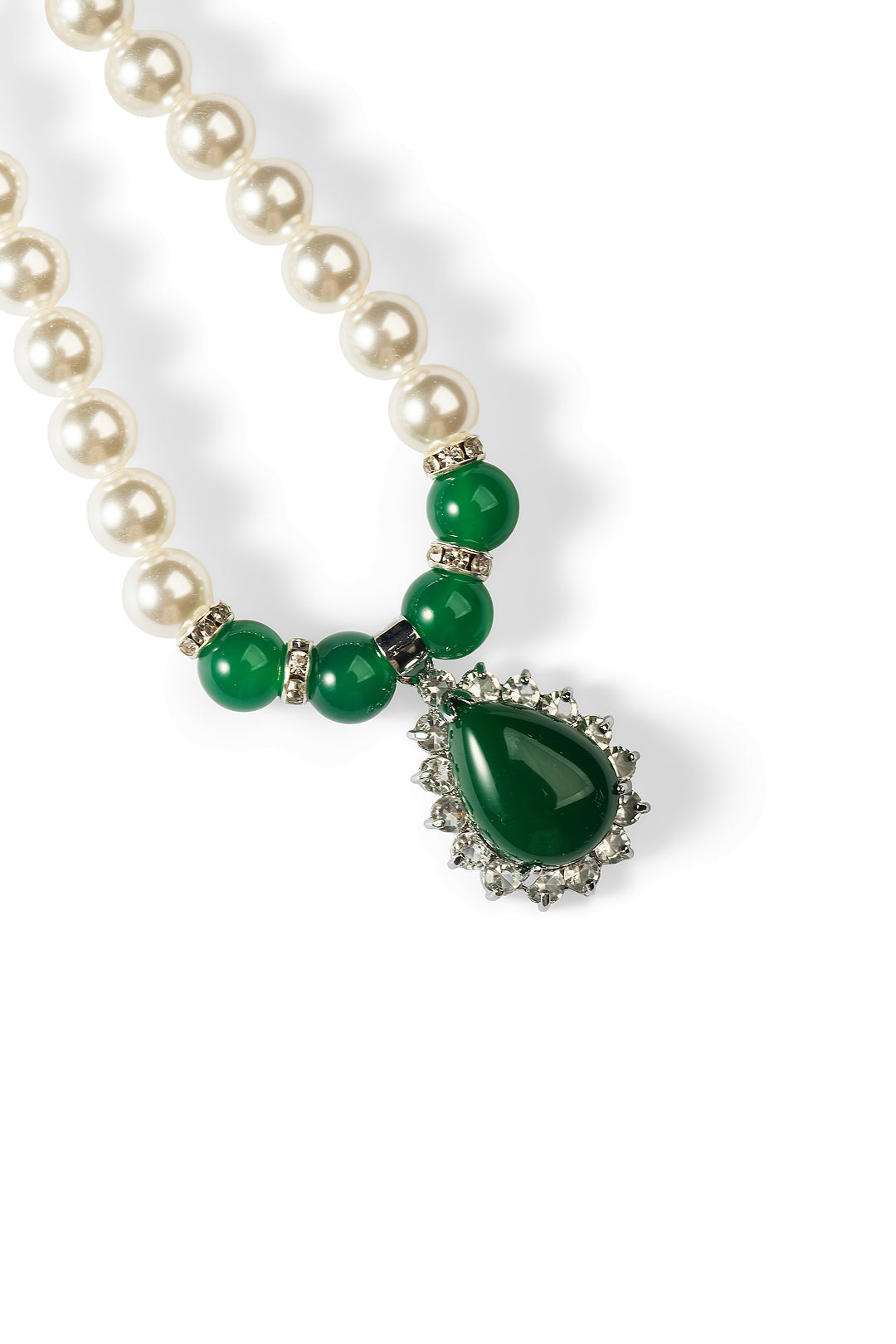 Close-up of the Aiko Tanaka Kokei pearl necklace showing green beads and a green teardrop pendant with a crystal halo