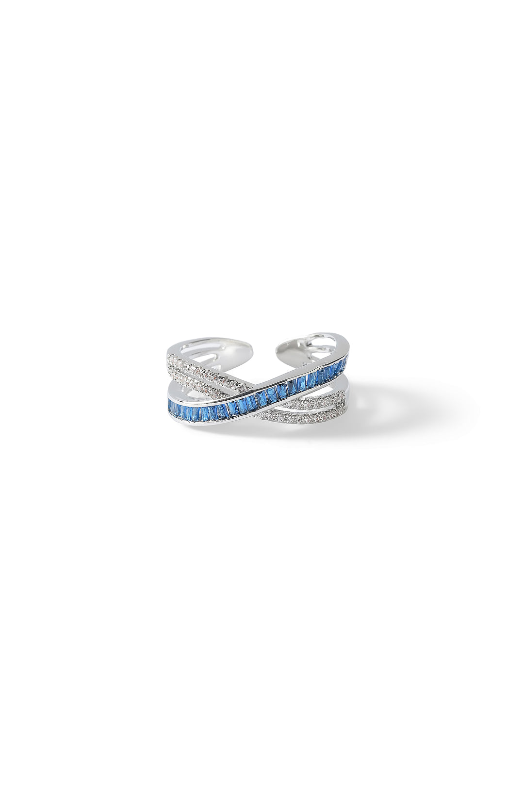 Aiko Tanaka Kosa silver crossover ring set with blue stones and white crystals, shown on a white background