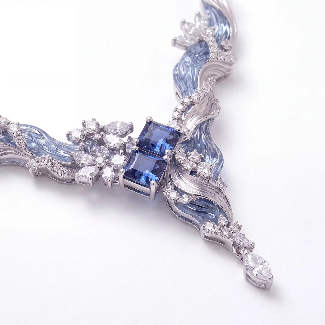 Aiko Tanaka High Jewelry No. 004 necklace close-up, a square blue stone at the center of silver and blue waves