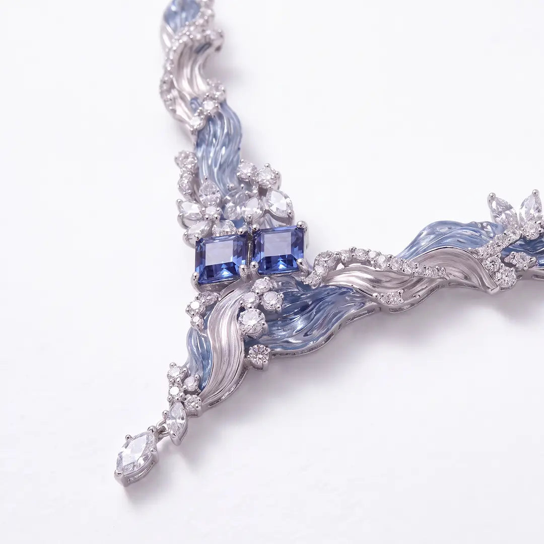 Aiko Tanaka High Jewelry No. 004 necklace detail, the V-shaped wave pendant with a blue stone and crystals