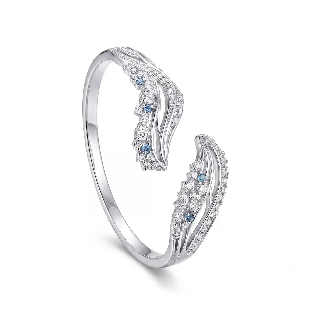 Aiko Tanaka High Jewelry No. 007 bracelet, a silver crystal cuff with wave-shaped ends and blue accents, white background