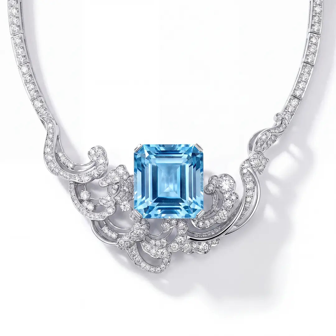 Aiko Tanaka High Jewelry No. 010 necklace close-up, an emerald-cut blue stone framed by crystal scrollwork