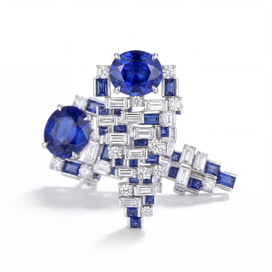 Aiko Tanaka High Jewelry No. 018 earrings shown overlapping, oval blue stones over blue and white baguette tiers