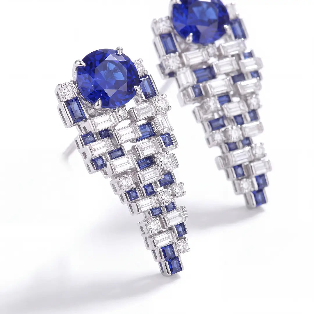 Aiko Tanaka High Jewelry No. 018 earrings, a pair of blue oval stones with stepped baguette drops, white background