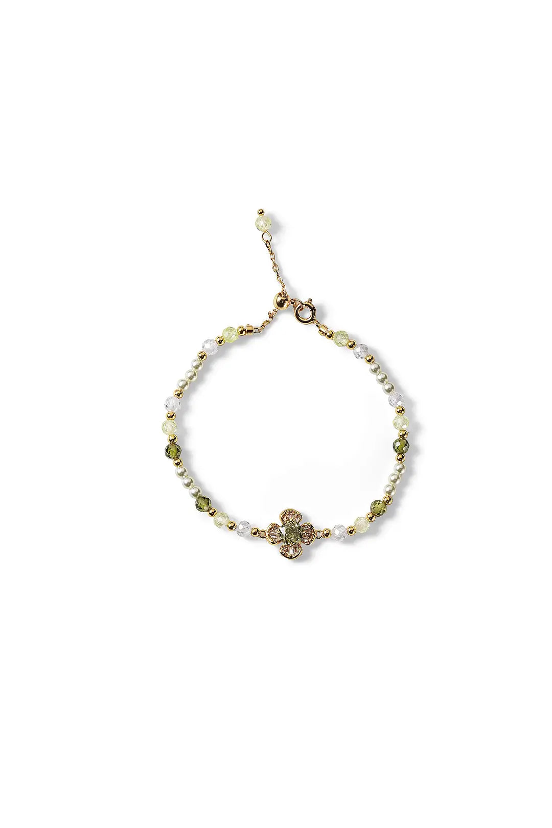 Aiko Tanaka Renka bracelet, a gold chain with pearls, green stones and a crystal flower charm, on a white background