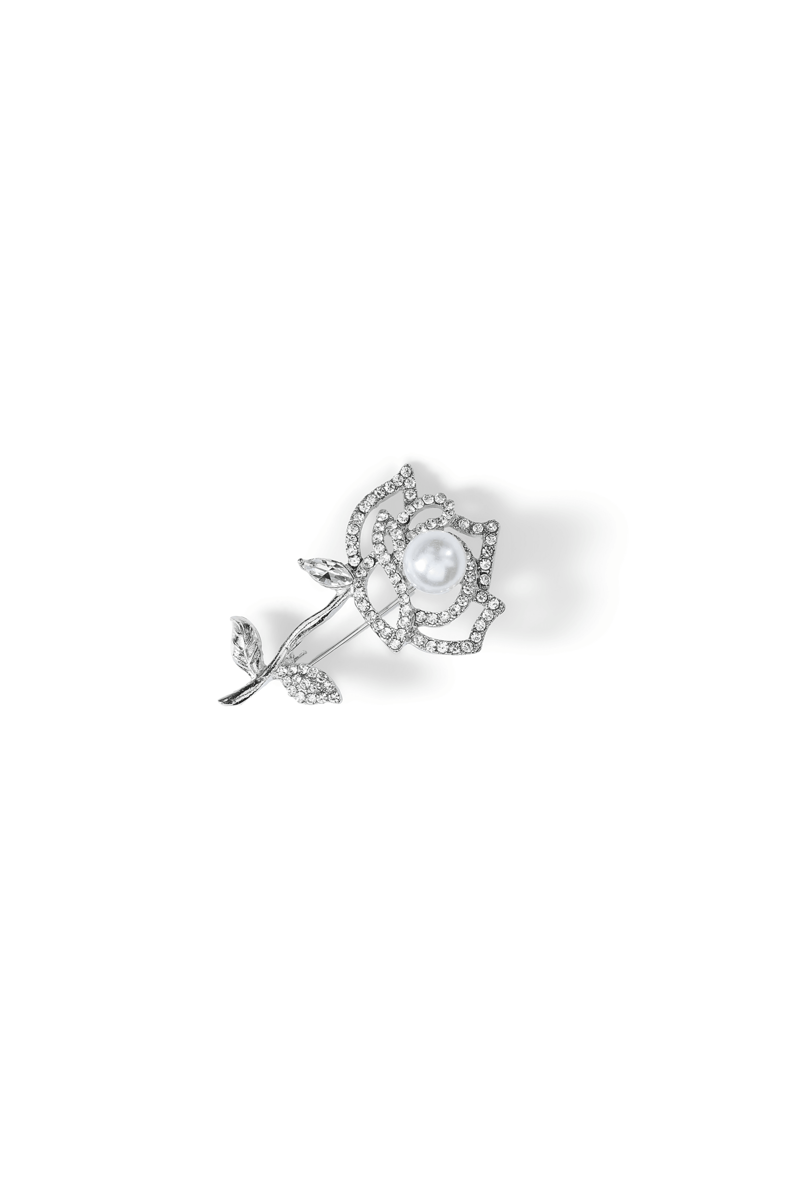 Aiko Tanaka Shiro Bara rose brooch in silver with pave crystal petals, a leafy stem and a white pearl center, on white
