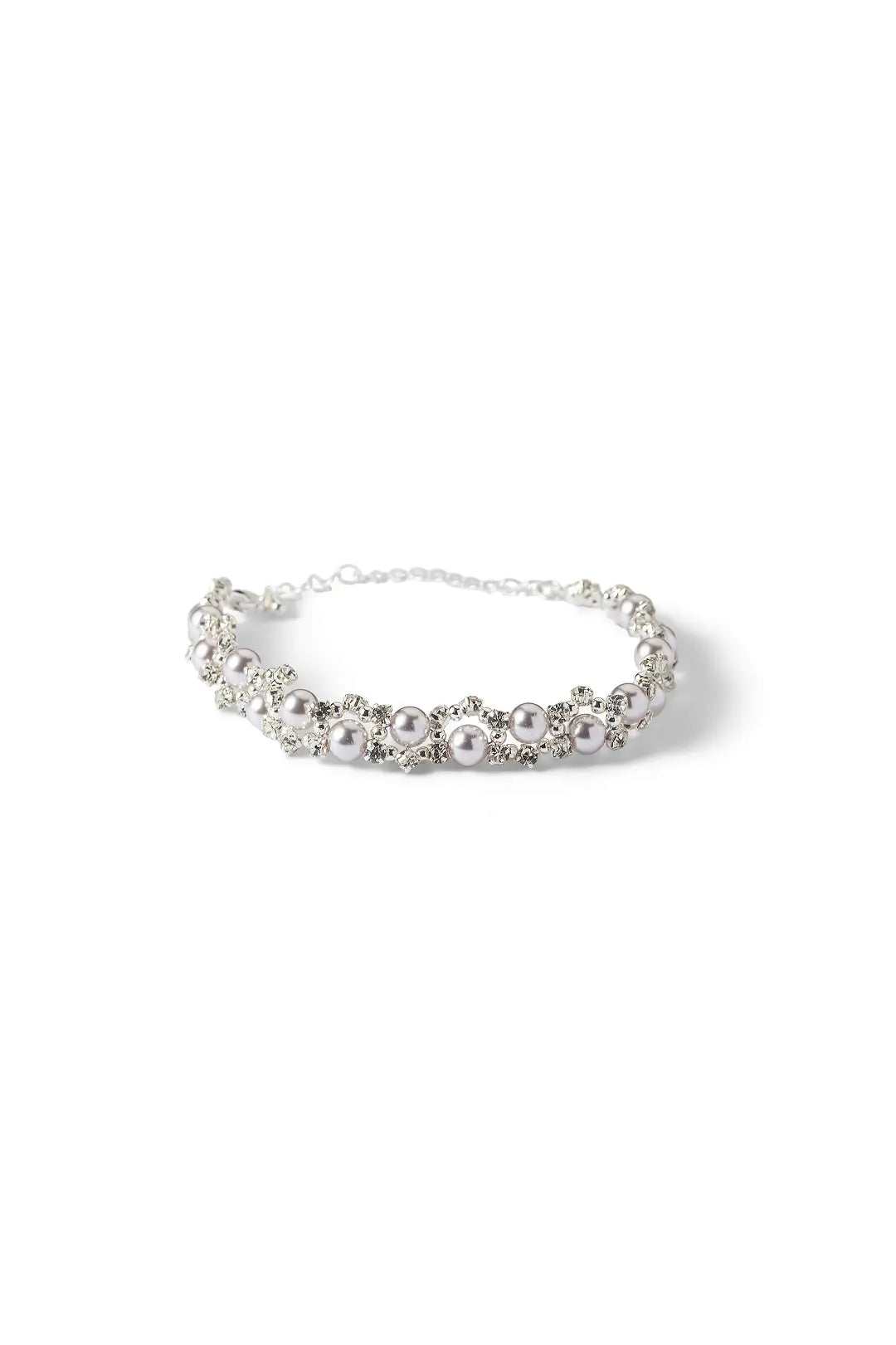 Aiko Tanaka Shirotsuyu bracelet, a silver chain of crystal-framed white pearls, shown on a white background