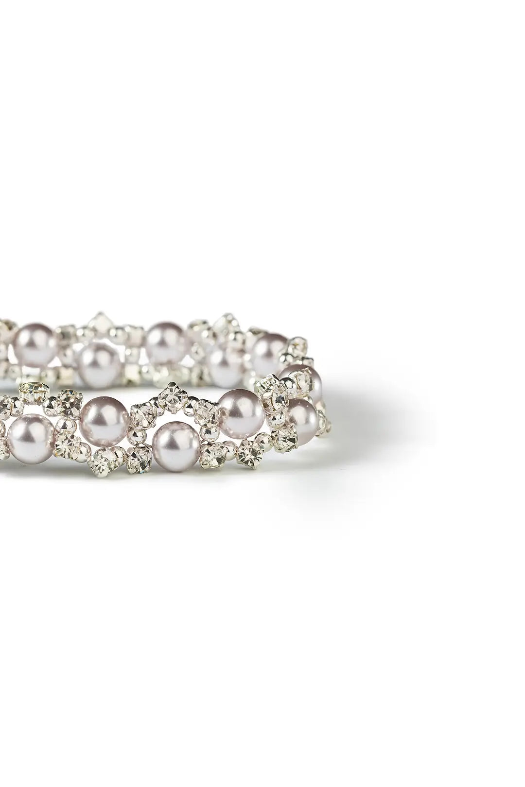 Aiko Tanaka Shirotsuyu bracelet close-up, rows of small pearls framed in crystal-set silver, on a white background