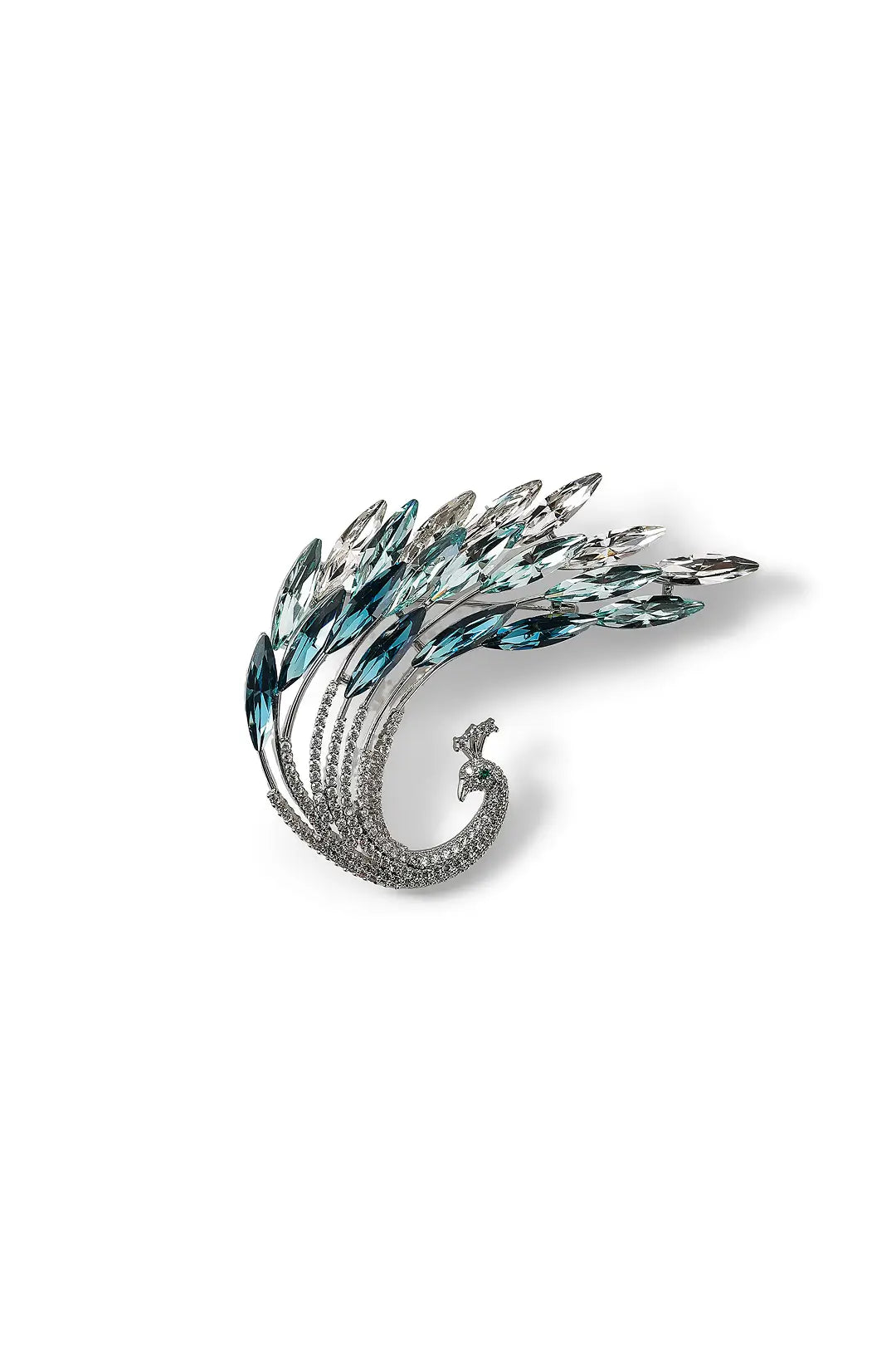 Aiko Tanaka Suibi brooch, a curling silver peacock feather set with teal and blue crystals, on a white background