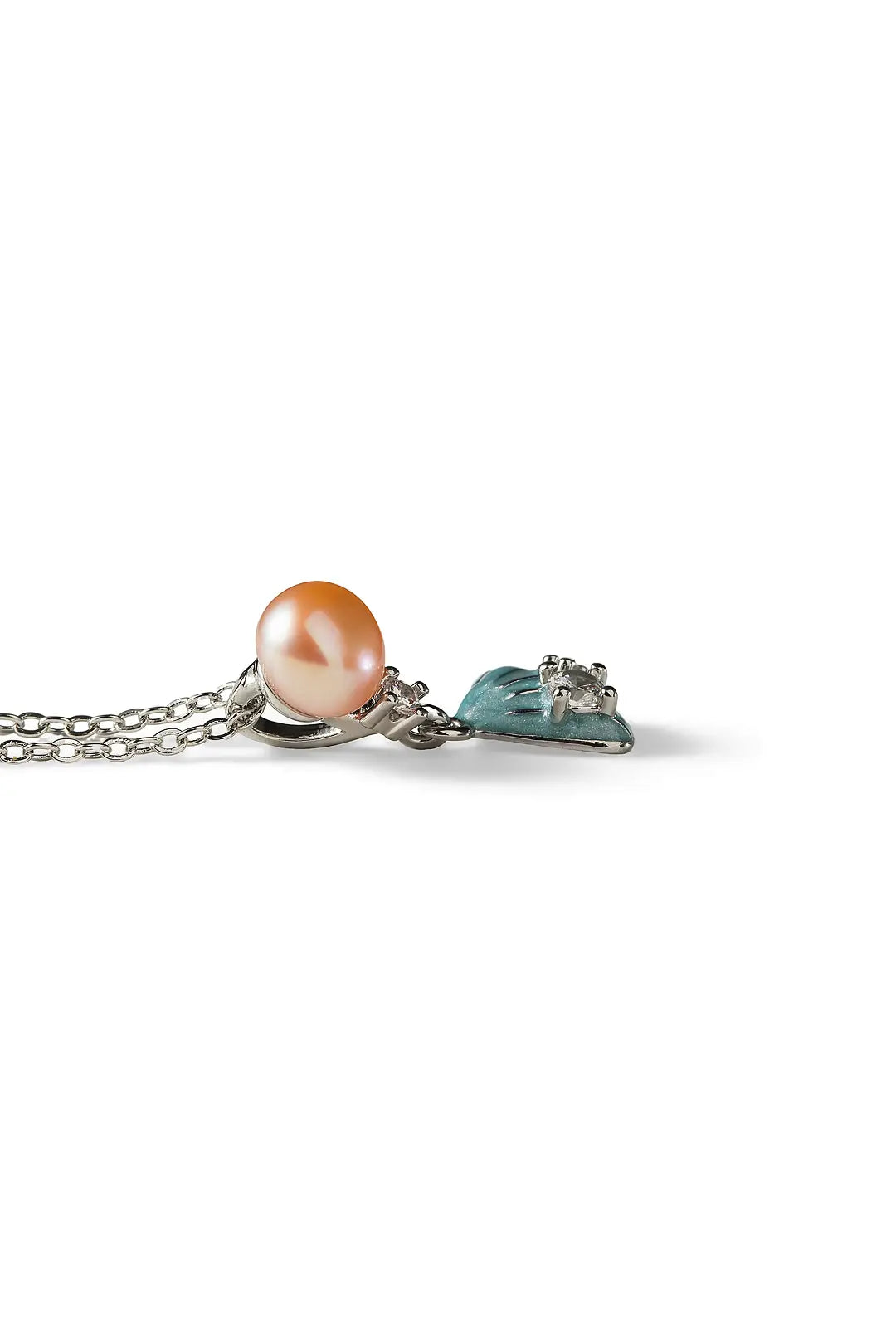 Aiko Tanaka Suiren necklace, a peach pearl and blue enamel lily pad pendant on a silver chain, white background