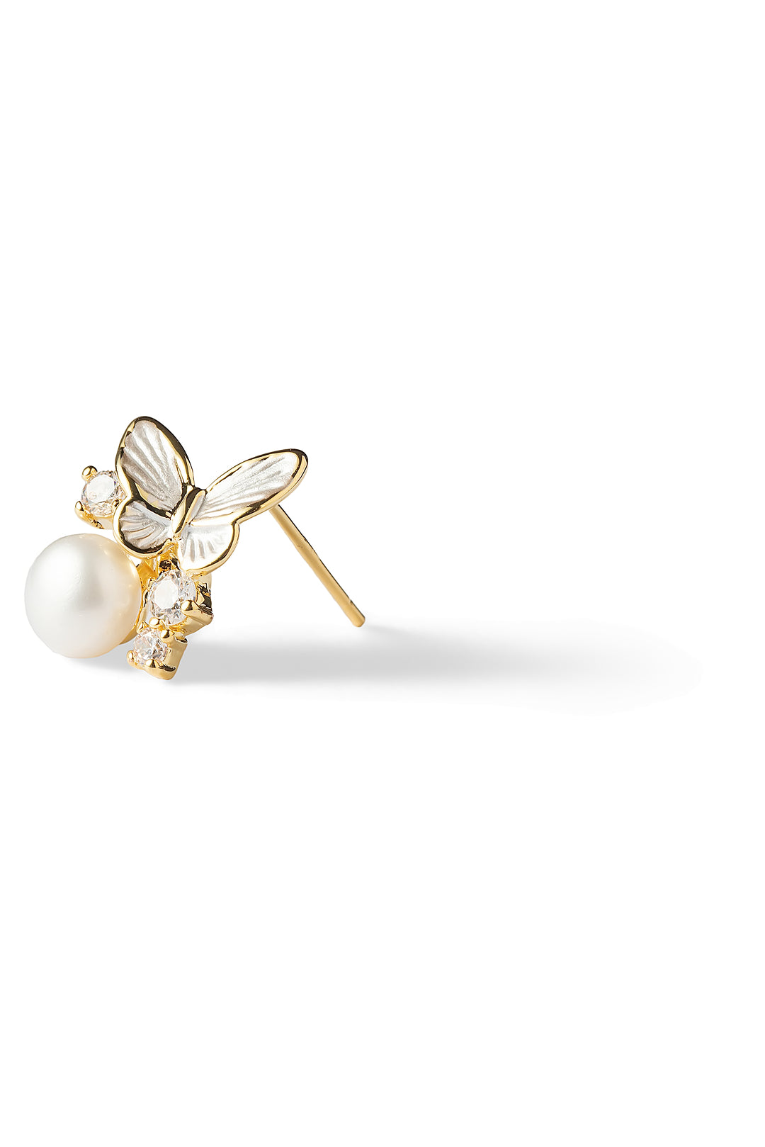 Side view of an Aiko Tanaka Yuki Cho earring with a mother-of-pearl butterfly and a white pearl drop, on white
